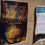 A flyer for "The George Floyd Uprising" book by "Vortex Group" seen at George Floyd Square on February 18, 2023.