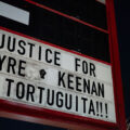 The signage at "The Peoples Way" reading “Justice for Tyre, Keenan & Tortuguita!!!"