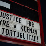 The signage at "The Peoples Way" reading “Justice for Tyre, Keenan & Tortuguita!!!"