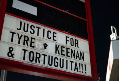The signage at "The Peoples Way" reading “Justice for Tyre, Keenan & Tortuguita!!!"