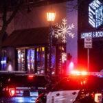 Minneapolis Police parked outside Uptown Ties Lounge & Rooftop on Lagoon Ave.