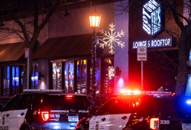 Minneapolis Police parked outside Uptown Ties Lounge & Rooftop on Lagoon Ave.