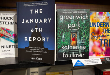 The January 6th Report on a bookshelf at Minneapolis-St. Paul International Airport.