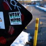 "Weak Mayor" sticker on a sign on the Midtown Greenway in Minneapolis on February 19, 2023.