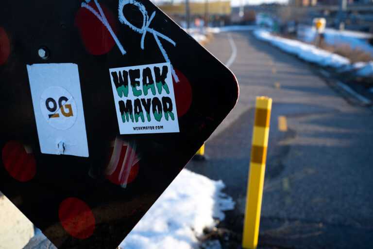 Weak Mayor Sticker seen on the Midtown Greenway 1 "Weak Mayor" sticker on a sign on the Midtown Greenway in Minneapolis on February 19, 2023.