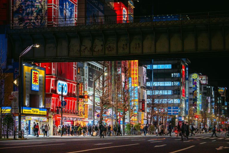 Chuo-dori Street, Akihabara, Tokyo 2 Neon-lit storefronts and crowds line a busy street in Akihabara, Tokyo at night.