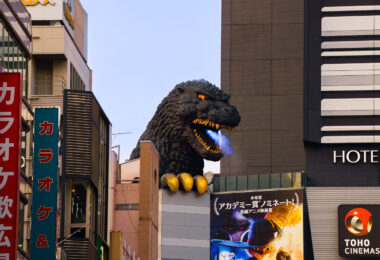 The Godzilla Head overlooking Kabukichō is one of Shinjuku’s most recognizable modern landmarks. Installed in 2015 to mark the opening of the Toho Cinemas Shinjuku complex—the studio responsible for the original 1954 Godzilla film—the sculpture rises above the building’s eighth floor, facing the main entertainment district.

The installation recreates Godzilla’s appearance from the 1990s Heisei-era films, and several times a day it emits sound, smoke, and light effects that mimic the creature’s trademark atomic breath. Positioned above the Kabukichō streetscape, the figure is intended as both a tribute to Japan’s most famous movie monster and a visual anchor for this entertainment-heavy part of Shinjuku.