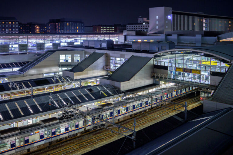 Kyoto Station Platforms at Night, Japan 2 Kyoto Station platforms and trains at night, Japan. The modern station serves as a major transportation hub for Shinkansen bullet trains and local lines.