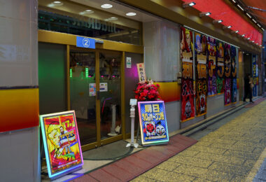Pachinko parlors remain a defining part of Japan’s postwar entertainment landscape, evolving from small mechanical game halls into large, brightly lit venues that line the streets of major cities. This Shinjuku location reflects the modern industry’s mix of gambling-adjacent gaming, animated advertising, and elaborate storefront displays designed to attract commuters and tourists.

Although pachinko operates in a legal gray zone—winnings are exchanged off-site to comply with gambling regulations—it has grown into a multibillion-yen sector with deep cultural roots, from the machines’ lineage in early 20th-century children’s games to their present role as a staple of urban nightlife.