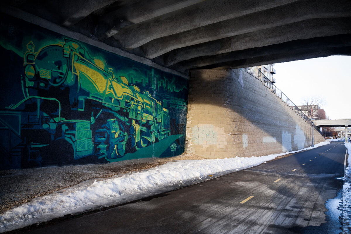 A train mural by Reggie LeFlore on the Midtown Greenway in South Minneapolis.