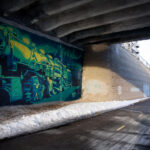 A train mural by Reggie LeFlore on the Midtown Greenway in South Minneapolis.