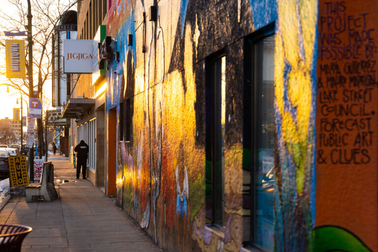 03/19/23 East Lake Street, Minneapolis 1 A security guard on East Lake Street in South Minneapolis.