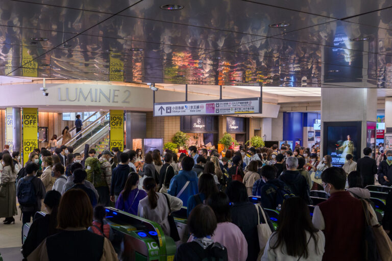 Shinjuku Station, Tokyo: Commuters Pass Through Lumine 2 Entrance 1 Commuters pass through the Lumine 2 entrance at Shinjuku Station, Tokyo, a major transit hub. Signage directs to Odakyu, Keio, and Toei subway lines.