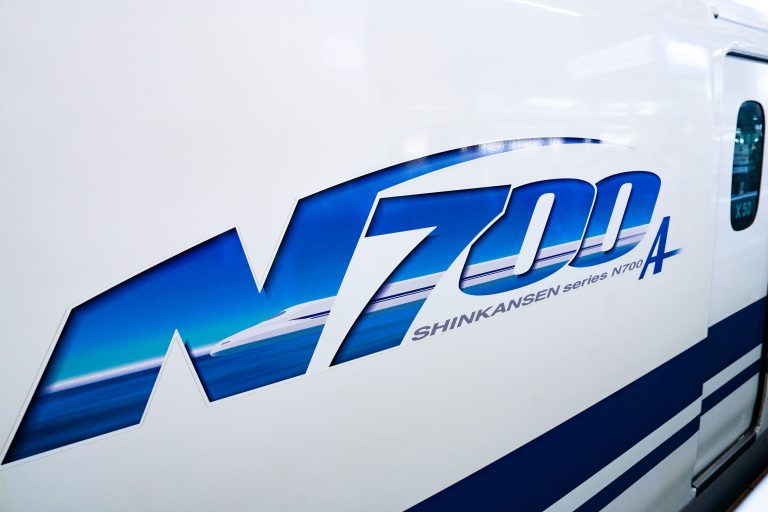 Shinkansen N700A Series Livery Detail 3 Blue and white N700A Shinkansen logo decal on the side of a Japanese high-speed train.