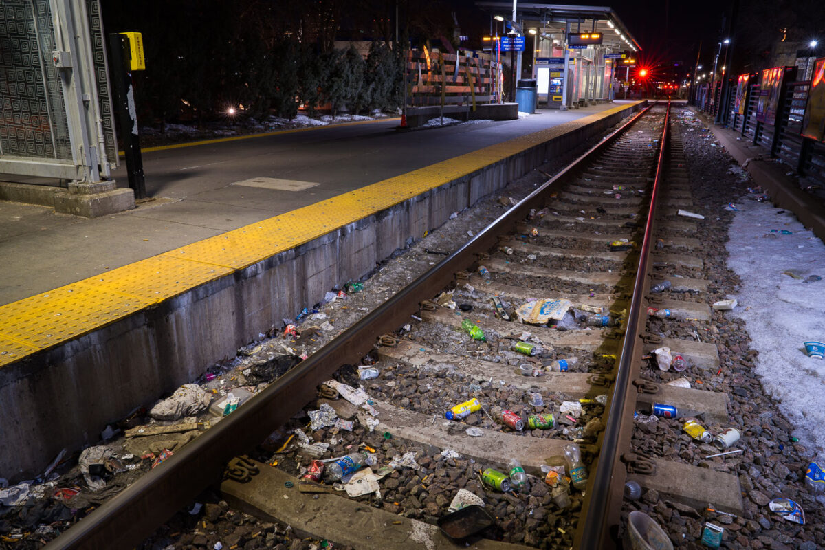 Discarded needles and trash line the tracks at the Cedar-Riverside LRT station.
