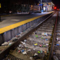 Discarded needles and trash line the tracks at the Cedar-Riverside LRT station.