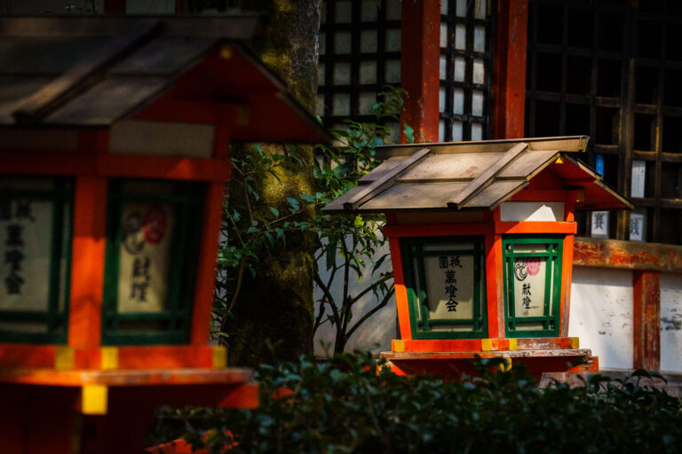 Yasaka Shrine Lanterns, Kyoto 2 Lanterns at Yasaka Shrine in Kyoto, Japan. These traditional Japanese lanterns, known as 'tōrō', are often donated as offerings and lit during festivals.