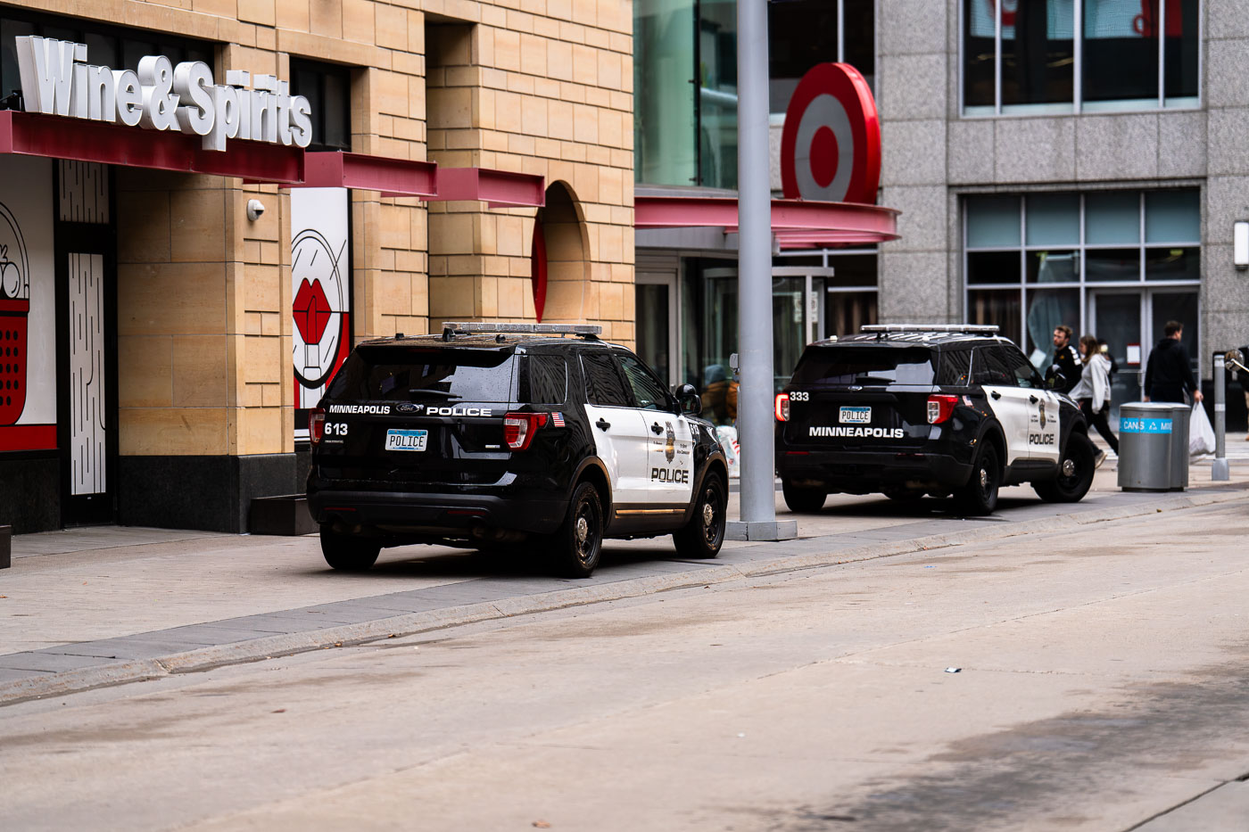 Minneapolis Police squad cars parked in front of Target on sidewalk