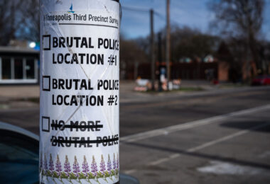 A "third precinct survey" sign on a pole in South Minneapolis. The city has been holding community meetings regarding the future of the burned out Minneapolis police third precinct.