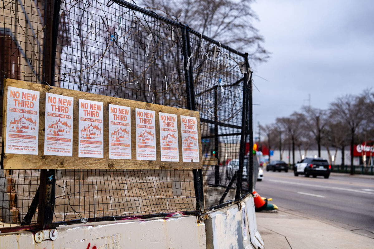 NO NEW THIRD signs on the burned police station