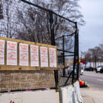Flyers reading "WE REMEMBER GEORGE FLOYD. WE DEMAND ABOLITION." hang on the former burned Minneapolis police 3rd precinct after a week of what is being called "community conversations". City is asking for input on if a precinct should be rebuilt at same location or down the road.