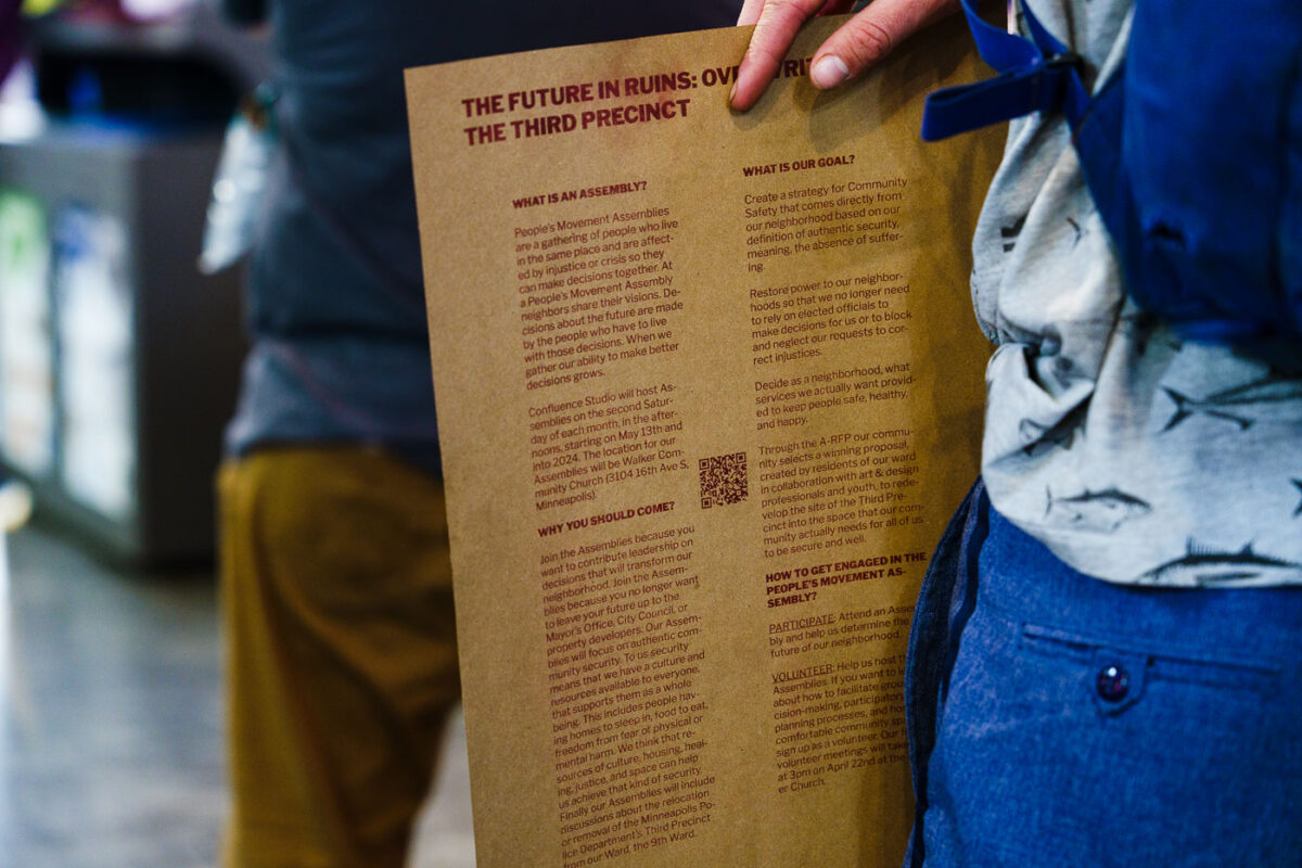 The Future In Ruins poster at community meeting