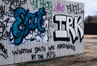 Graffiti reading "Winston Smith was assassinated by the MPD on the Cedar Lake Trail in April 2023.