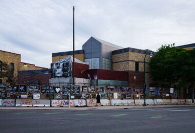 Posters line the fencing of the Minneapolis police third precinct on the 3 year anniversary of it being burned by protesters.