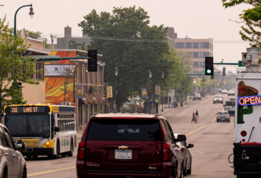Hazy skies over Lake Street in South Minneapolis during bad air quality from Canadian wildfire smoke drifting south.
