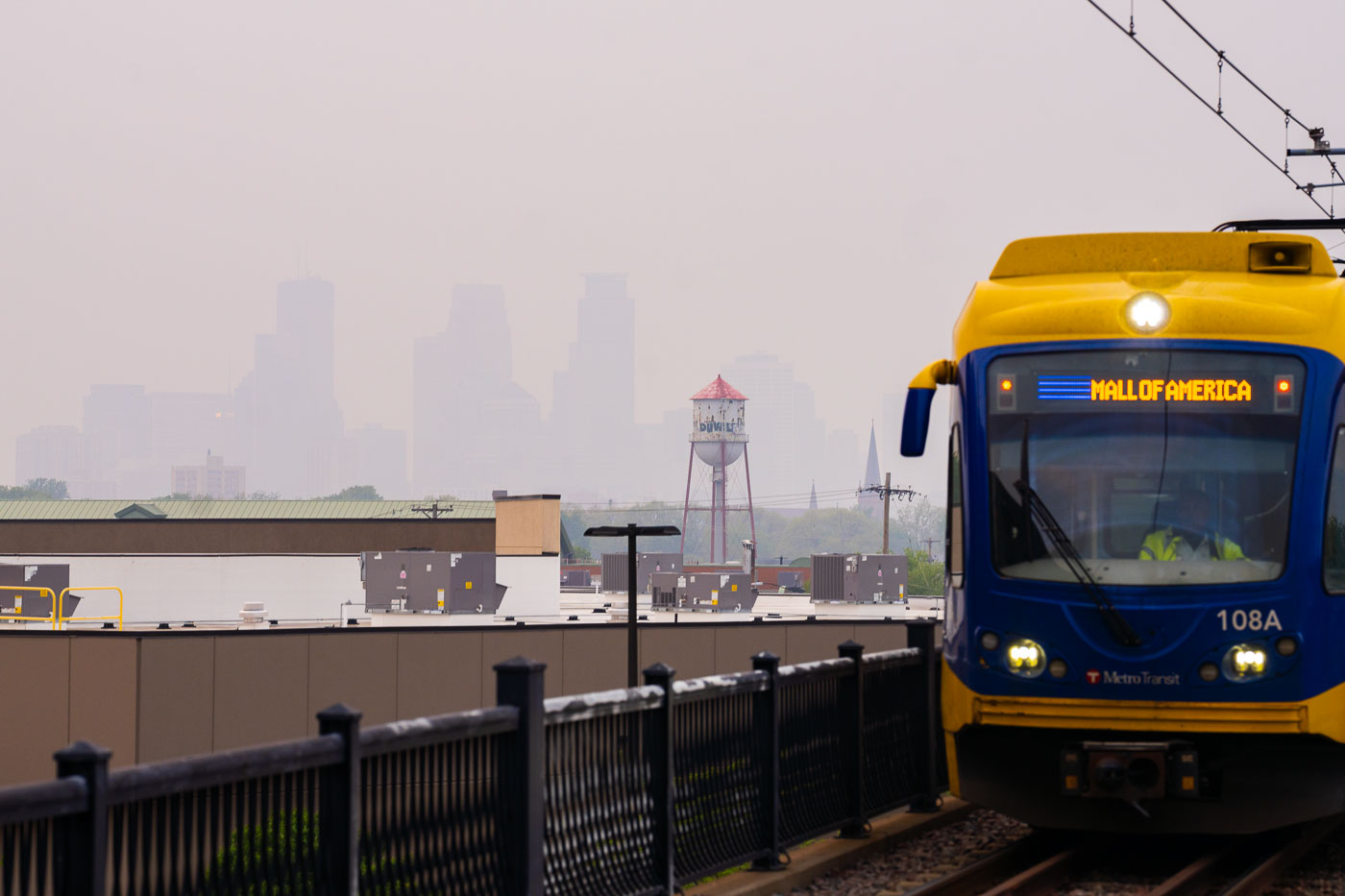 Light rail train and hazy wildfire skies in Minneapolis