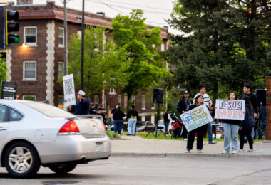 Victory Outreach holding signs on Hennepin Avenue in Uptown Minneapolis.