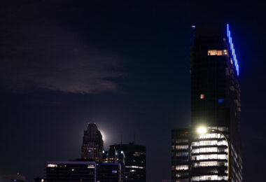 Full Moon in Downtown Minneapolis behind Wells Fargo Center and the Four Seasons Hotel.