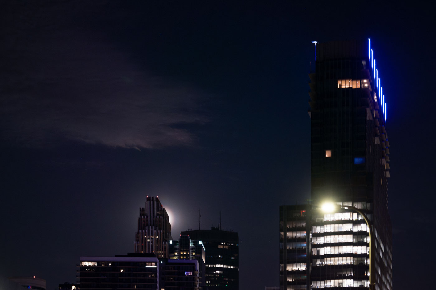 Full Moon rising behind Wells Fargo tower in Downtown Minneapolis