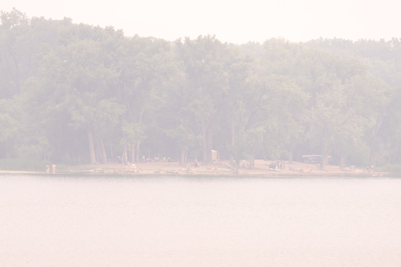 People at Hidden Beach during wildfire smoke Minneapolis