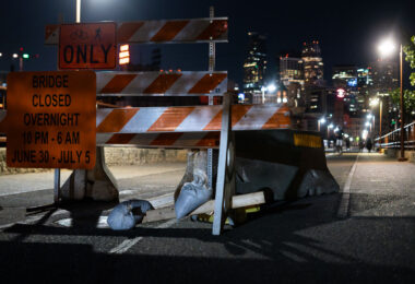 Signage on the Stone Arch Bridge preparing for overnight closures.