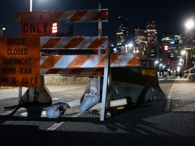 Barricades at Stone Arch Bridge's Overnight Closure, Minneapolis Skyline Beyond