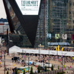 Taylor Siwft signage on US Bank Stadium as fans arrive for the Eras Tour.