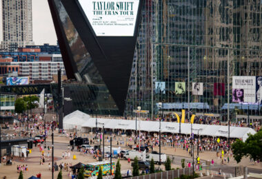 Taylor Siwft signage on US Bank Stadium as fans arrive for the Eras Tour.