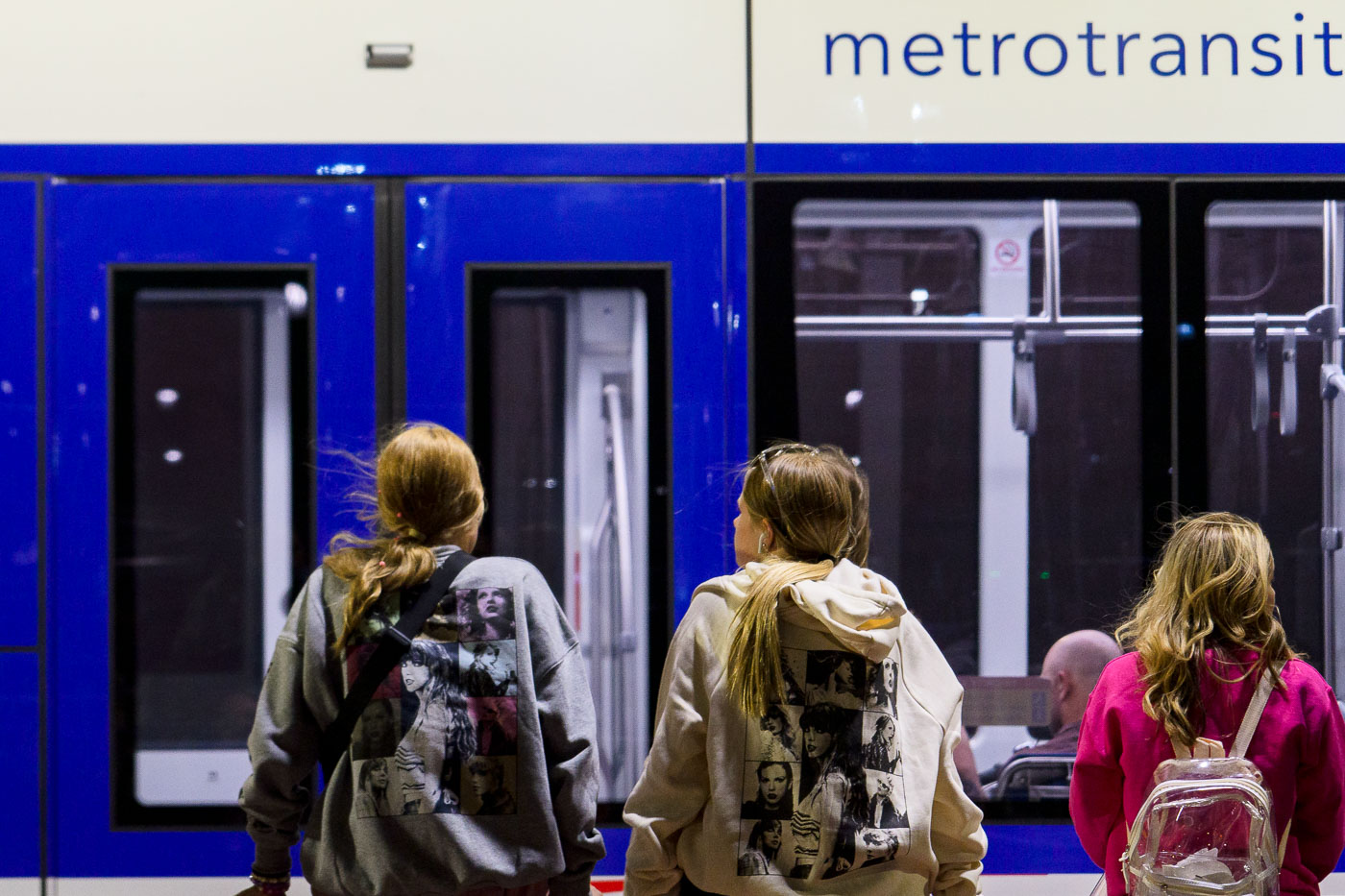 Taylor Swift fans wait to board light rail train in Minneapolis