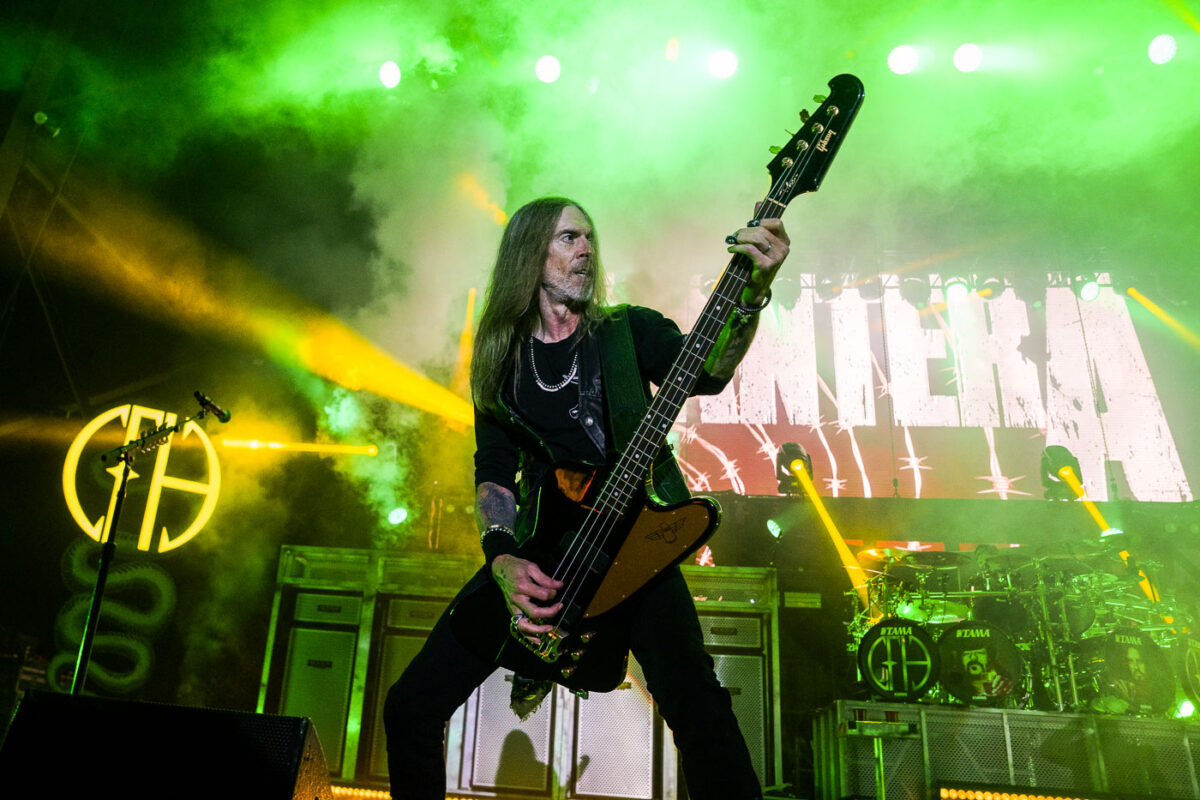 Bassist Rex Brown performs with the band Pantera at Rock Fest in Cadott, Wisconsin, on July 13, 2023. Rock Fest is an annual heavy metal music festival held in Cadott, Wisconsin, known for attracting major bands and a large audience. Pantera, a highly influential American heavy metal band, reunited for a series of performances in 2023, marking a significant moment for their fans. The festival provides a platform for both established and emerging artists in the rock and metal genres, contributing to the cultural landscape of Wisconsin's music scene.
