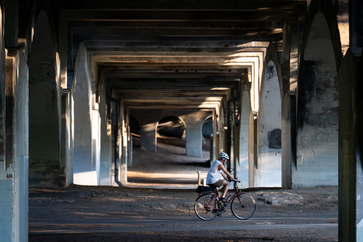 A biker under the Nicollet Ave bridge in Minneapolis.