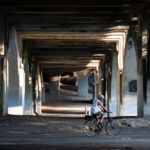 A biker under the Nicollet Ave bridge in Minneapolis.