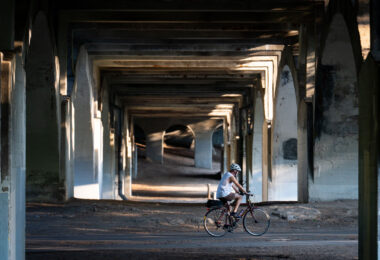 A biker under the Nicollet Ave bridge in Minneapolis.