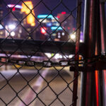 Looking through locked fence of the Stone Arch Bridge. The bridge was closed due to reports of late night crime.