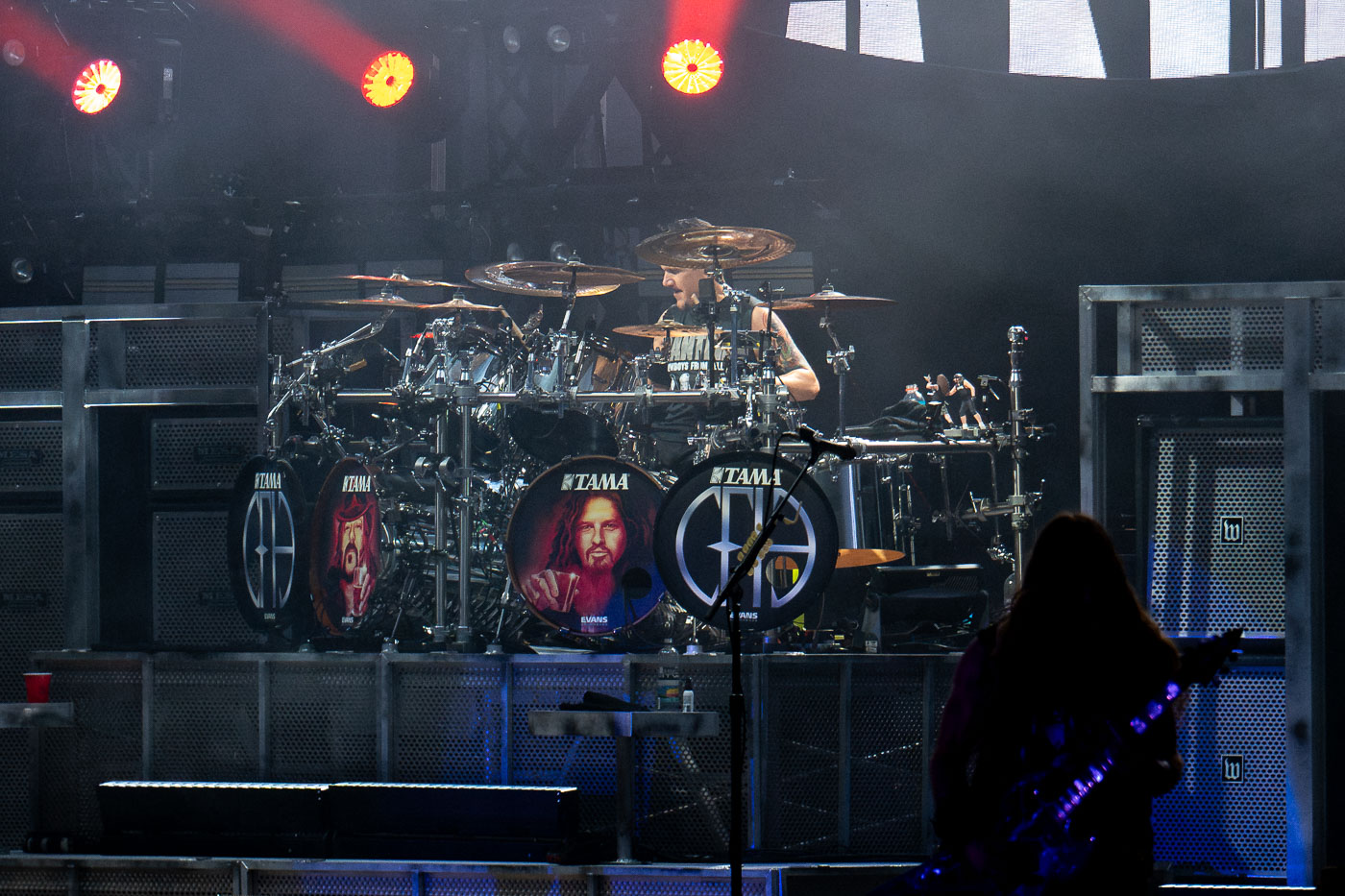 Drummer Charlie Benante performs with the band Pantera at Rock Fest in Cadott, Wisconsin, on July 13, 2023. Rock Fest is an annual music festival held in Cadott, known for featuring a variety of rock and metal bands. Pantera, a highly influential heavy metal band, reunited for a tour in 2023, marking a significant moment for their fans. The festival provides a platform for both established and emerging artists to perform for large audiences in an outdoor setting.