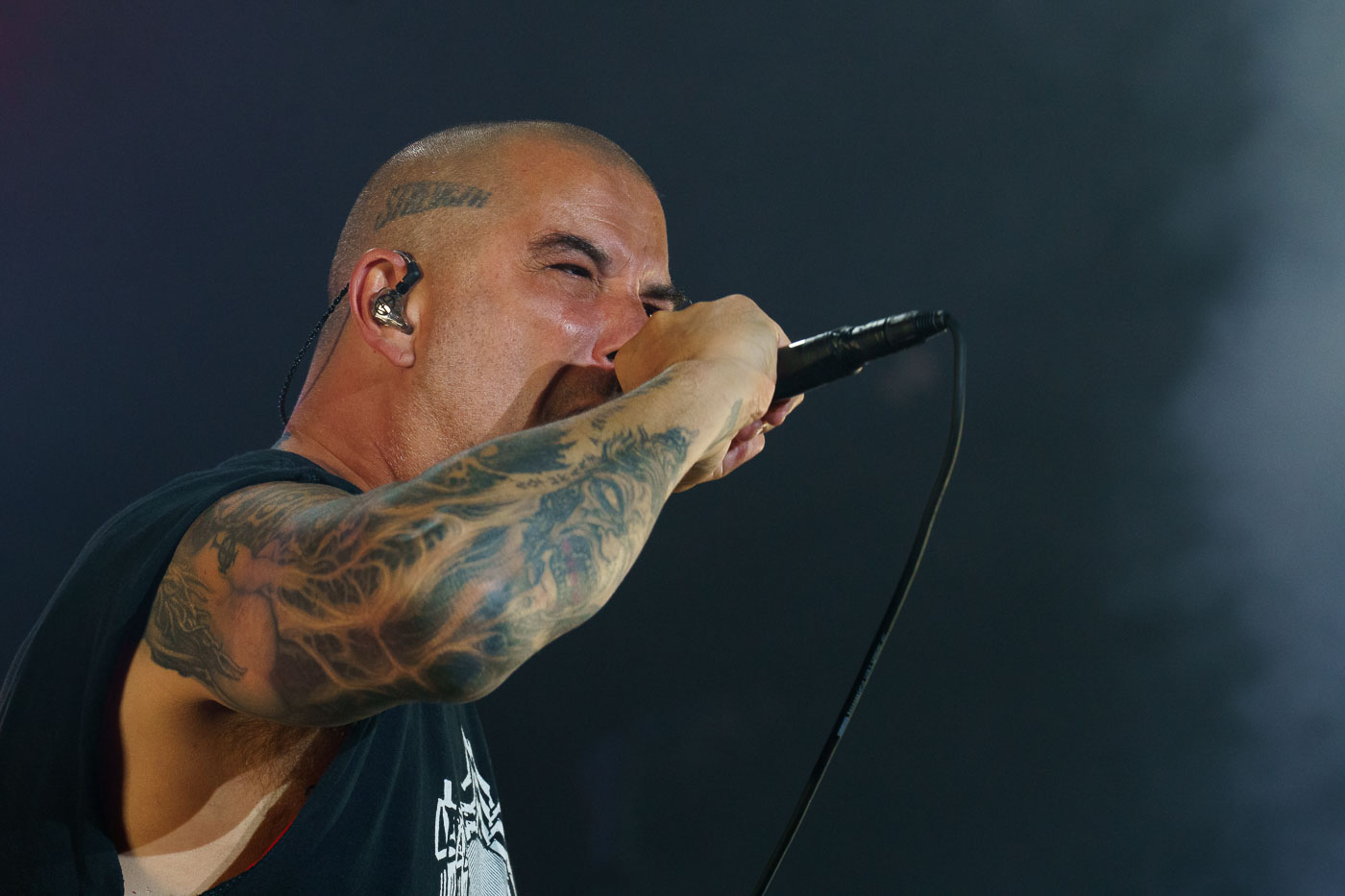 Phil Anselmo, vocalist for the band Pantera, performs at Rock Fest in Cadott, Wisconsin, on July 13, 2023. Rock Fest is an annual music festival held in Cadott, Wisconsin, known for featuring a variety of rock and metal bands. The festival has been a significant event in the region's music calendar since its inception, drawing fans from across the country. This performance marks a notable appearance by Pantera, a band with a substantial legacy in the heavy metal genre.