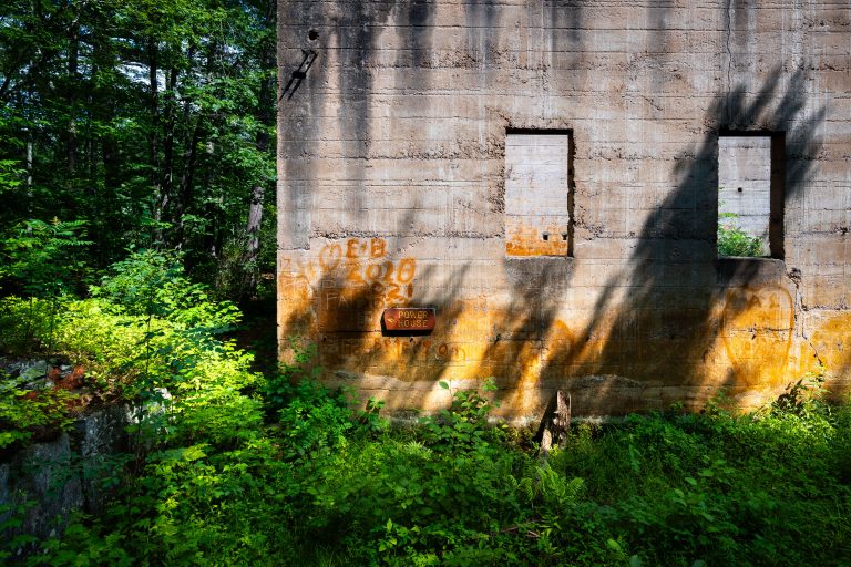Power House Ruins, Banning State Park, Sandstone, Minnesota 1 Abandoned power house with yellow graffiti and boarded windows at Banning State Park, Sandstone, Minnesota.