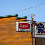 Signs outside the Squirrel Cage bar in Willow River Minnesota.