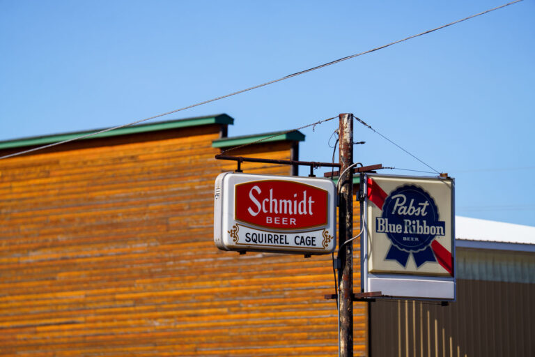 Signs outside the Squirrel Cage bar in Willow River Minnesota.