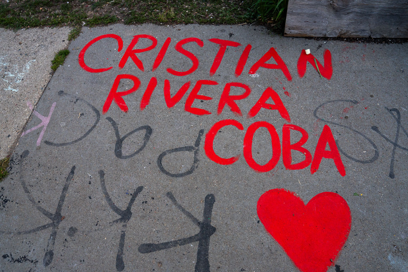Cristian Rivera Coba and heart painted on sidewalk